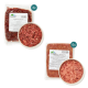Rohe Haustierfutterpakete und eine Schüssel mit Hackfleisch, beschriftet "Haustierkost", mit "Geflügelfleisch-Mix" und "Rindfleisch."