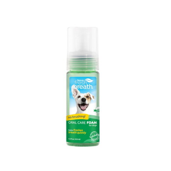 TropiClean Fresh Breath dog oral care foam bottle, label: 'no brushing!' and 'helps freshen breath quickly'.