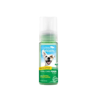 TropiClean Fresh Breath dog oral care foam bottle, label: 'no brushing!' and 'helps freshen breath quickly'.