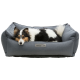 Ein entspannter Collie-Hund, der auf einem gemütlichen grauen Haustierbett liegt, mit einem Etikett, das "homeEdition" liest.