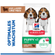 Hill's Science Plan Welpenfutterbeutel mit zwei Beaglewelpen; zeigt „PUPPY <1“, „mit Lamm & Reis“, „5 ESSENTIELLE VORTEILE“