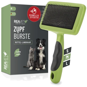 Grüne Tierpflegebürste mit Metallborsten neben einer Box mit einer Katze und einem Hund, beschriftet mit "REAVET care me ZUPF BÜRSTE MITTEL-LANGHAAR."