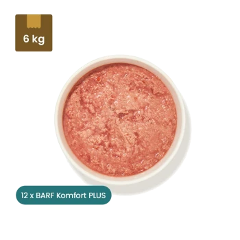 Verpacktes Haustierfutter mit der Aufschrift "BARF Komfort PLUS Lamm" für Hunde und Katzen, mit einer 500g Portion und Nährwertangaben auf der Rückseite.