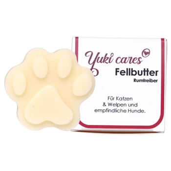 Yuki cares Fellbutter, ein pfotenförmiges Pflegeprodukt für Haustiere, mit Verpackung, die besagt "Für Katzen & Welpen und empfindliche Hunde."