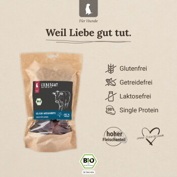 Liebesgut Bio‑Rind Hundesnack‑Beutel mit der Aufschrift ‚Weil Liebe gut tut.‘ und Symbolen: Glutenfrei, Getreidefrei, Laktosefrei, Single‑Protein