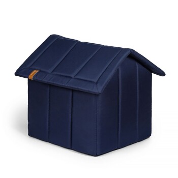 Marineblaue Haustierunterkunft mit gepolstertem Dach und Wänden, mit einem kleinen braunen Etikett an der Seite.