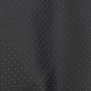Nahaufnahme eines strukturierten schwarzen Stoffes mit kleinen erhabenen Punkten, geeignet für Haustierbekleidung oder -zubehör.