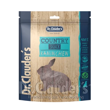 Dr. Clauder's Country Snack für Kaninchen, mit einem Holz-Hintergrund und einer Silhouette eines Kaninchens. Der Text enthält "100% Kaninchen" und "Seit 1957."