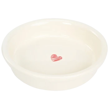 A round, cream-colored pet food bowl with a small red heart design in the center.