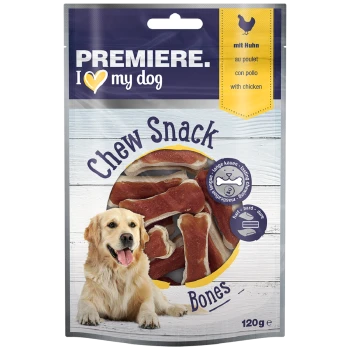 Ein Golden Retriever sitzt neben einem Paket mit "Premiere I ♥ my dog" Kausnacks, das knochenförmige Leckereien mit Hühnergeschmack enthält.