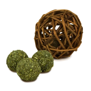 A woven wooden ball next to three green herbal treat balls for pets, ideal for chewing and play.