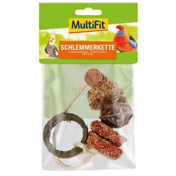 Jouet à friandises MultiFit Schlemmerkette pour animaux de compagnie, comprenant un anneau en bois, une balle couverte de graines et une balle tissée, emballé dans un sac transparent.