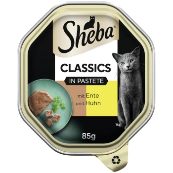Classics in Pastete 22x85g mit Ente und Huhn Sheba Classics Katzenfutter in Pastete, mit Ente und Huhn, 85g Verpackung mit einem grünen Teller mit Futter und Kräutern.