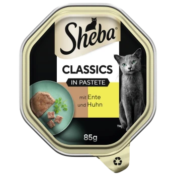 Sheba Classics Katzenfutter in Pastete, mit Ente und Huhn, 85g Verpackung mit einem grünen Teller mit Futter und Kräutern.