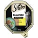 Sheba Classics Katzenfutter in Pastete, mit Ente und Huhn, 85g Verpackung mit einem grünen Teller mit Futter und Kräutern.