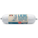 Emballage cylindrique de nourriture pour chien étiqueté "natura DOG" avec une illustration de chien bleu et du texte en allemand, français et italien.