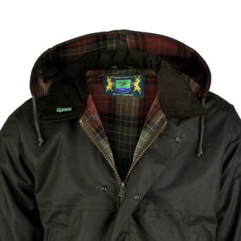 Dunkelgrüne gewachste Jacke mit kariertem Futter, Cordkragen und "Hunter Outdoor British Lifestyle"-Etikett innen.