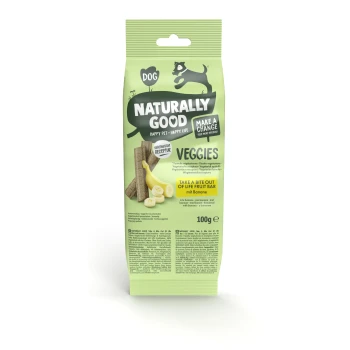 Green packaging for "Naturally Good" dog treats labeled "Veggies," featuring banana slices and veggie sticks, 100g.