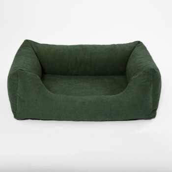Grünes Haustierbett mit einem weichen, strukturierten Stoff und erhöhten Rändern, entworfen für Komfort und Unterstützung.