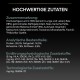 Haustierfutteretikett, das hochwertige Zutaten wie Lamm und Reis zeigt, zusammen mit Nährwertanalyse und Zusatzstoffen.