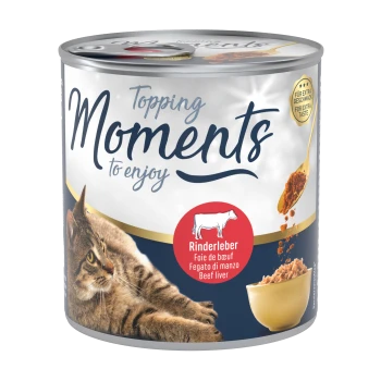 A can of pet food labeled "Moments to enjoy" featuring a cat and a bowl of beef liver topping, with text in multiple languages.