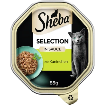 Selection in Sauce 22x85 g mit Kaninchenhäppchen Sheba Selection in Sauce Katzenfutterverpackung mit einem Gericht aus zerrissenem Fleisch mit Kräutern, gekennzeichnet mit "mit Kaninchen," 85g.
