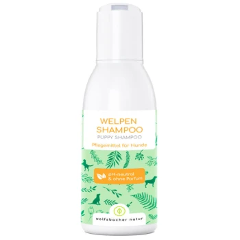 Flasche "Welpen Shampoo" für Hunde, mit einem grünen Etikett mit Hund- und Blattillustrationen, pH-neutral und duftfrei.