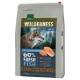 A bag of Real Nature Wilderness Adult dog food with a wolf profile, forest backdrop, and "60% FRESH FISH" highlighted.