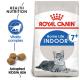 Royal Canin Indoor 7+ cat food bag featuring a gray tabby cat, with text highlighting "Health Nutrition" and "Vitality complex."