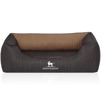 Ein stilvolles Hundebett in Dunkelgrau mit einem hellbraunen Innenraum, mit einer gerippten Textur und dem Logo 'KNUFFELWUFF', das prominent angezeigt wird.