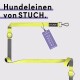 Eine leuchtend gelbe Hundeleine von STUCH, mit einem schwarzen Griff mit dem Markennamen und einem Etikett mit der Aufschrift "Vegan Approved."