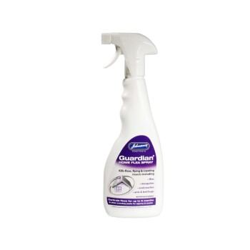 White trigger spray bottle labeled "Johnson's Guardian Home Flea Spray" — kills fleas, flying and crawling insects.