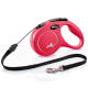 Bright pink retractable dog leash with a black strap, silver clip, ergonomic handle, and "flexi MADE IN GERMANY" logo.