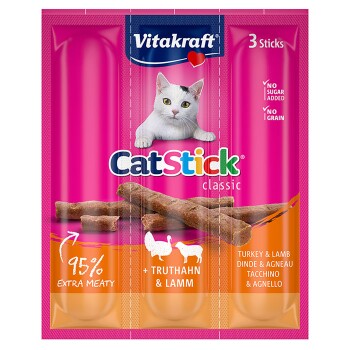 Vitakraft CatStick verpakking toont drie vleesachtige sticks met een kattenafbeelding en tekst: '95% Extra Vleesachtig,' 'Geen Suiker Toegevoegd,' 'Geen Granen.'