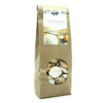 Braune Papiertüte mit natürlichen Haustierergänzungen, beschriftet mit 'Gelenke & Knochen' und einem transparenten Fenster, das runde Leckerlis zeigt.