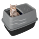 Grau-schwarze Katzentoilette mit Deckel und Einstieg von oben sowie strukturierter oberer Rampe; eine getigerte Katze lugt durch die seitliche Öffnung