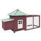 Holzhaustierhaus mit grünem Dach, mit einer kleinen Tür und einem angeschlossenen Außenbereich mit Drahtgeflecht.