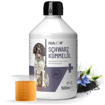 Flasche REAVET Schwarzkümmelöl (schwarzes Kümmelöl) für Haustiere, 500ml, mit einem Messbecher Öl und einem Hundebild auf dem Etikett.