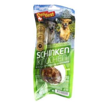 DeliBest Premium-Hundeleckerli-Verpackung mit einem Schweineknochen, beschriftet mit "Schinken Knochen", mit Bildern von Hunden und einem grünen Hintergrund.