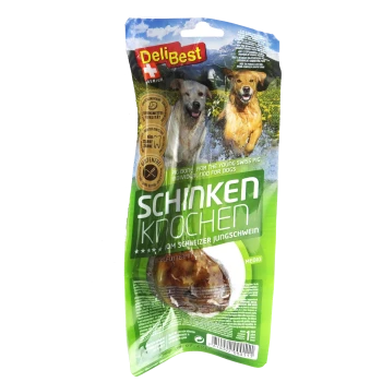DeliBest Premium-Hundeleckerli-Verpackung mit einem Schweineknochen, beschriftet mit "Schinken Knochen", mit Bildern von Hunden und einem grünen Hintergrund.
