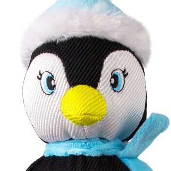 Close-up of a plush penguin toy with blue eyes, yellow beak, and blue winter hat and scarf.