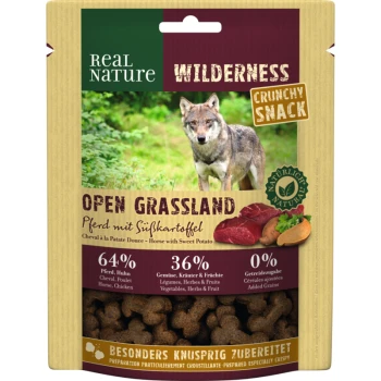 WILDERNESS Crunchy Snack 225 g Cheval à la Patate douce Emballage de collation pour animaux avec un loup dans l'herbe, étiqueté "Real Nature Wilderness Crunchy Snack" avec 64 % de cheval/poulet, 36 % de légumes/herbes/fruits.
