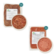 Zwei Pakete mit rohem Haustierfutter, beschriftet mit "BARF Komfort PLUS" in 500g Portionen, mit einer Schüssel mit Hackfleisch in der Mitte.