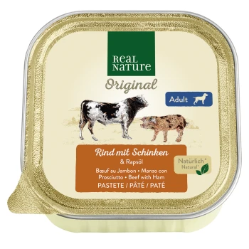 Adult Rind und Schinken 17x100 g Verpackung von Real Nature Original Hundefutter mit Rindfleisch, Schinken und Rapsöl, gekennzeichnet für erwachsene Hunde, mit Illustrationen einer Kuh und eines Hundes.