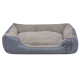 Graues Hundebett mit plüschigem Innenraum und erhöhten Seiten, mit einem Pfotenabdruckdesign auf der Vorderseite.