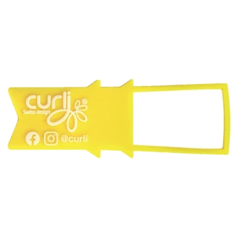 Yellow pet accessory tag with "curlij" logo, "Swiss design," and social media icons for Facebook and Instagram.