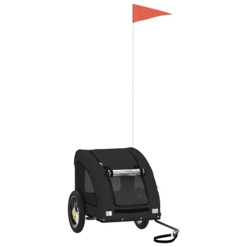 Schwarzer Haustieranhänger mit zwei Rädern, einem Netz vorne für Sichtbarkeit und einer roten Sicherheitsflagge auf einem Mast.