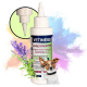 Flasche mit Vetiness Ohrentropfen für Hunde und Katzen, mit einem Tropferoberteil, umgeben von Lavendel und grünen Pflanzen, mit buntem Hintergrund.