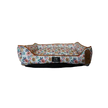 Colorful floral rectangular pet bed with raised bolsters, brown trim and center label reading Beddies