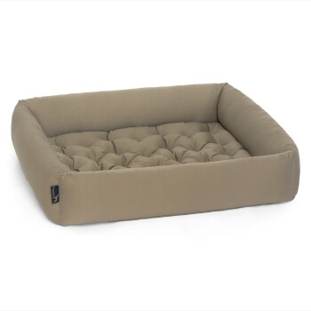 Ein plüschiges, rechteckiges Haustierbett in sanftem Beige mit gepolstertem Komfort und erhöhten Rändern.